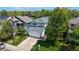 Aerial view of a well-kept home with a lush lawn and mature trees in a desirable neighborhood at 13464 Vine St, Thornton, CO 80241