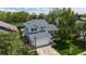Aerial view of a lovely home with a lush yard, mature trees, and a serene neighborhood setting at 13464 Vine St, Thornton, CO 80241