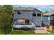 The property boasts a well-maintained backyard with a deck and patio at 13464 Vine St, Thornton, CO 80241