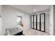 Versatile finished basement space with entertainment options and modern storage at 13464 Vine St, Thornton, CO 80241
