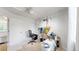 This well-lit room offers a ceiling fan, closet, a desk with monitors and storage for art supplies at 13464 Vine St, Thornton, CO 80241