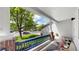 Inviting front porch with blue railing and stylish decor, perfect for enjoying a peaceful neighborhood view at 13464 Vine St, Thornton, CO 80241