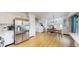 Spacious kitchen with stainless steel appliances flows into a dining area and study nook at 13464 Vine St, Thornton, CO 80241