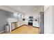 Bright kitchen features stainless steel appliances, white cabinets, and plenty of counter space at 13464 Vine St, Thornton, CO 80241