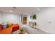 Bright living room with a TV, sofa, and built-in shelving for a cozy, functional space at 13464 Vine St, Thornton, CO 80241
