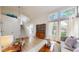 Spacious living room features a large window and modern decor with a staircase nearby at 13464 Vine St, Thornton, CO 80241