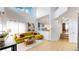 Open concept living room boasts high ceilings, modern decor, and plenty of natural light at 13464 Vine St, Thornton, CO 80241
