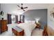 Serene main bedroom boasts a vaulted ceiling, dark accent wall and plenty of natural light at 13464 Vine St, Thornton, CO 80241