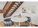 Dining area features a modern table and chairs, with a staircase and mirror nearby at 1941 Newland Ct, Lakewood, CO 80214