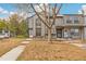 Two story townhome features tidy landscaping and sidewalk at 1941 Newland Ct, Lakewood, CO 80214