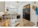 Spacious kitchen with granite countertops and modern appliances at 1941 Newland Ct, Lakewood, CO 80214