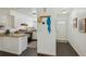 View of the kitchen featuring white cabinets and granite countertops at 1941 Newland Ct, Lakewood, CO 80214