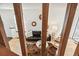 Living room with hardwood floors, fireplace, and access to private fenced outdoor area at 1941 Newland Ct, Lakewood, CO 80214