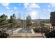 Balcony with railing, trees, and sunny view at 1052 Country Club Estates Dr, Castle Rock, CO 80108