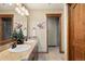Primary bathroom with double sinks, granite countertops, and a glass-enclosed shower at 1052 Country Club Estates Dr, Castle Rock, CO 80108