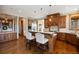 Beautiful kitchen with a functional island, custom cabinets, and stainless steel appliances, creating a chef's dream space at 1052 Country Club Estates Dr, Castle Rock, CO 80108