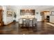 Well-appointed kitchen with stone accents, a breakfast bar, and custom wooden cabinets at 1052 Country Club Estates Dr, Castle Rock, CO 80108