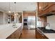 Beautiful kitchen features stainless steel appliances, wooden cabinets, and stone countertops at 1052 Country Club Estates Dr, Castle Rock, CO 80108