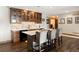 Kitchen with a breakfast bar, granite countertops, custom cabinets, and stainless steel appliances at 1052 Country Club Estates Dr, Castle Rock, CO 80108