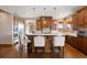 Well-appointed kitchen featuring a center island with seating, ample counter space, and modern appliances at 1052 Country Club Estates Dr, Castle Rock, CO 80108