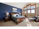 Spacious bedroom with vaulted ceilings, large windows, and a private balcony at 1052 Country Club Estates Dr, Castle Rock, CO 80108