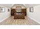 Sun-filled office with custom built-in shelving and a large desk at 1052 Country Club Estates Dr, Castle Rock, CO 80108