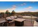 Comfortable patio seating includes a fire pit and relaxing views at 1052 Country Club Estates Dr, Castle Rock, CO 80108