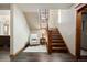 Well lit staircase with an accent chair at 1052 Country Club Estates Dr, Castle Rock, CO 80108