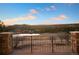 Breathtaking view from a deck showcasing the surrounding landscape, including rolling hills and a tranquil pond at 1052 Country Club Estates Dr, Castle Rock, CO 80108