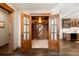 View through double doors to a well-stocked wine cellar, adjacent to the kitchen at 1052 Country Club Estates Dr, Castle Rock, CO 80108