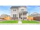 Charming two-story home with stone accents, well-manicured lawn, and inviting curb appeal at 22323 E 6Th Pl, Aurora, CO 80018
