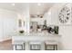 Modern kitchen with granite countertops, stainless steel appliances, and a convenient breakfast bar at 22323 E 6Th Pl, Aurora, CO 80018