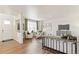 Bright living room with hardwood floors, neutral decor, and large windows for natural light at 22323 E 6Th Pl, Aurora, CO 80018