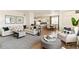 Open-concept living area showcasing a cozy seating arrangement and seamless flow to the kitchen at 22323 E 6Th Pl, Aurora, CO 80018
