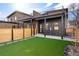 A modern backyard is shown with artificial turf and a contemporary design, ideal for outdoor living at 19 Washington Ave, Golden, CO 80403