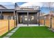This is a modern fenced backyard with artificial turf, perfect for relaxation and low maintenance at 19 Washington Ave, Golden, CO 80403