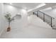Finished basement with a staircase, large mirror, and neutral carpeting at 19 Washington Ave, Golden, CO 80403