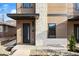 Modern home entrance featuring wood and stone elements, and a contemporary black door at 19 Washington Ave, Golden, CO 80403