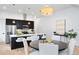 Modern kitchen featuring stainless steel appliances, a center island, pendant lighting, and seating at 19 Washington Ave, Golden, CO 80403