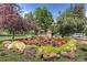 Picturesque park view with the Lions Park statue surrounded by colorful flowers and lush greenery at 19 Washington Ave, Golden, CO 80403