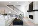 Bright living room with a stone fireplace, modern staircase, and a comfortable sectional sofa at 19 Washington Ave, Golden, CO 80403