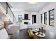 Bright living room featuring a fireplace with white stone surround and an adjacent dining area at 19 Washington Ave, Golden, CO 80403