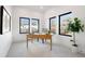 Bright office with large windows, desk, and a view at 19 Washington Ave, Golden, CO 80403