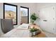 Cozy office space filled with natural light from large windows and a wooden desk at 19 Washington Ave, Golden, CO 80403