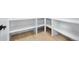 Walk-in pantry with white shelving and light hardwood floors provides ample storage space at 19 Washington Ave, Golden, CO 80403