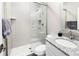 Modern bathroom with a granite countertop, sleek fixtures, and a glass-enclosed shower at 6530 Barnstead Dr, Castle Pines, CO 80108