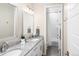 Bright bathroom with double sinks, granite countertops, and a tiled shower/tub combo at 6530 Barnstead Dr, Castle Pines, CO 80108