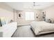Bright bedroom with a ceiling fan and two windows at 6530 Barnstead Dr, Castle Pines, CO 80108