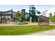 Community playground with a large jungle gym, slides, and climbing features at 6530 Barnstead Dr, Castle Pines, CO 80108