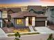 Beautiful single-Gathering home with a well-manicured lawn, lush landscaping, and stylish exterior at 6530 Barnstead Dr, Castle Pines, CO 80108